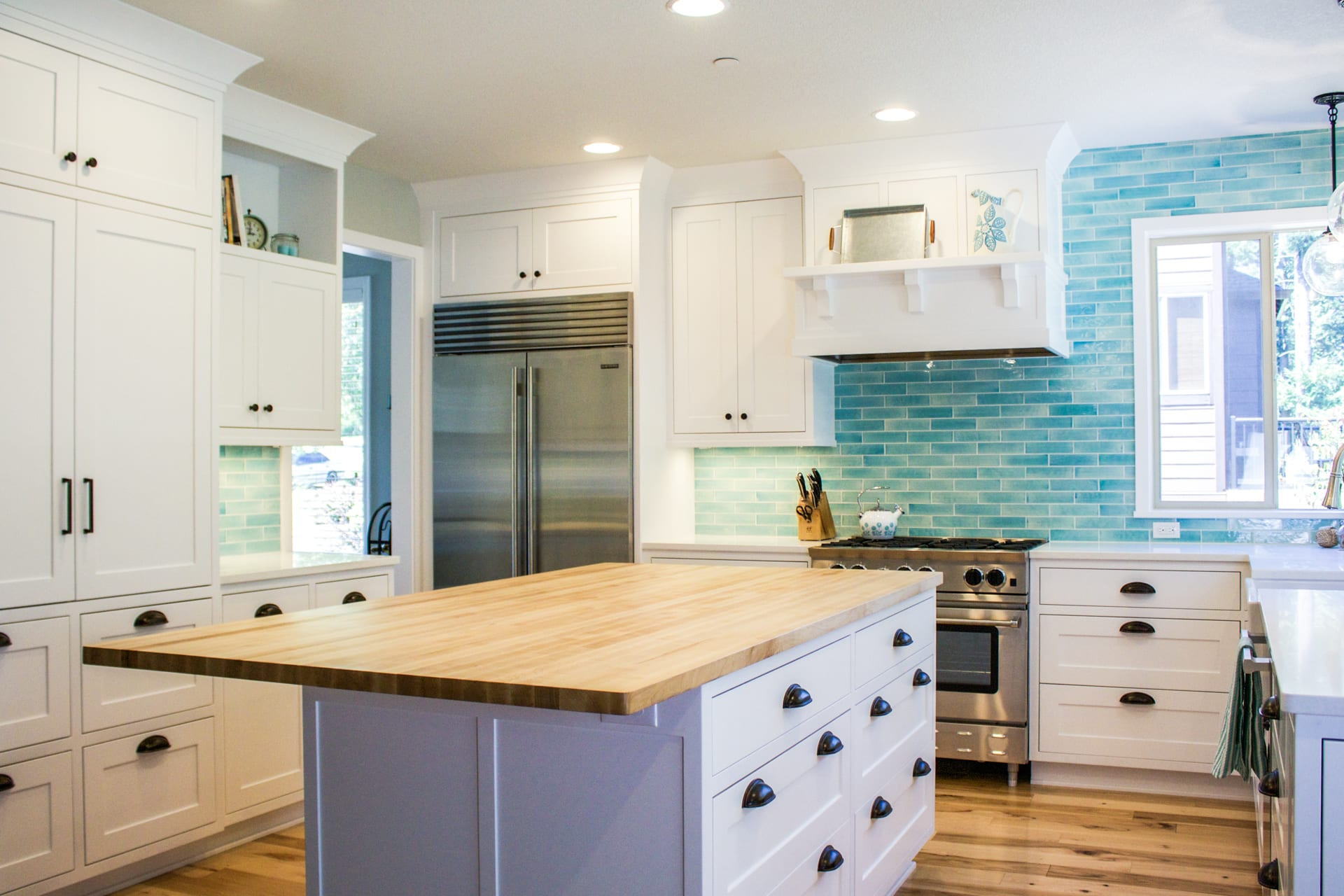 Blue Kitchen Tile
 Custom designed kitchen with white cabinets and bold blue