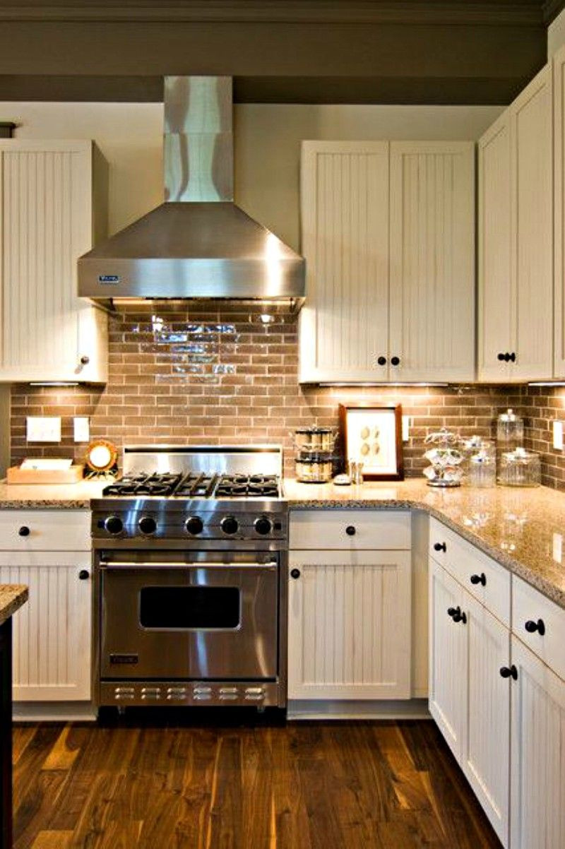 Country Kitchen Backsplashes
 Farmhouse kitchen with brick backsplash and wood floors