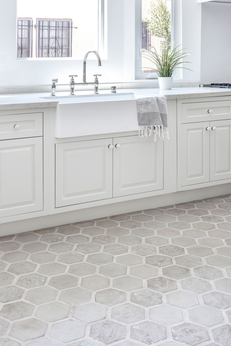 Hexagon Kitchen Floor Tiles
 Light gray hexagon concrete flooring in this neutral