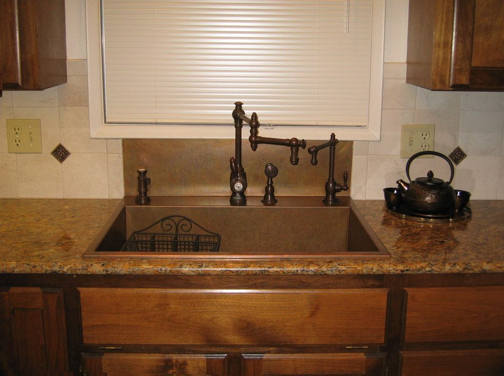 Kitchen Sink Backsplashes
 Like the integrated backsplash that goes up to the window