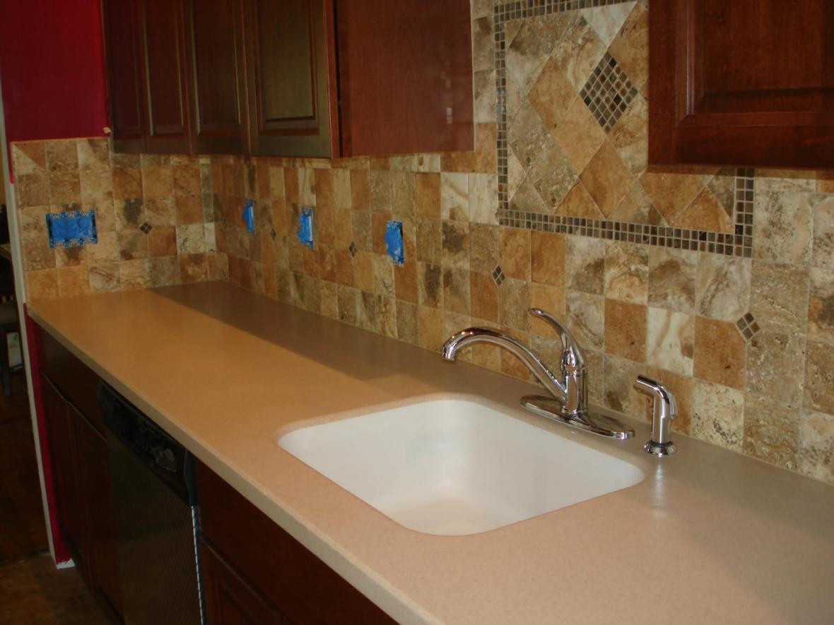 Kitchen Sink Backsplashes
 Porcelain 4x4 kitchen tile backsplash with accent behind