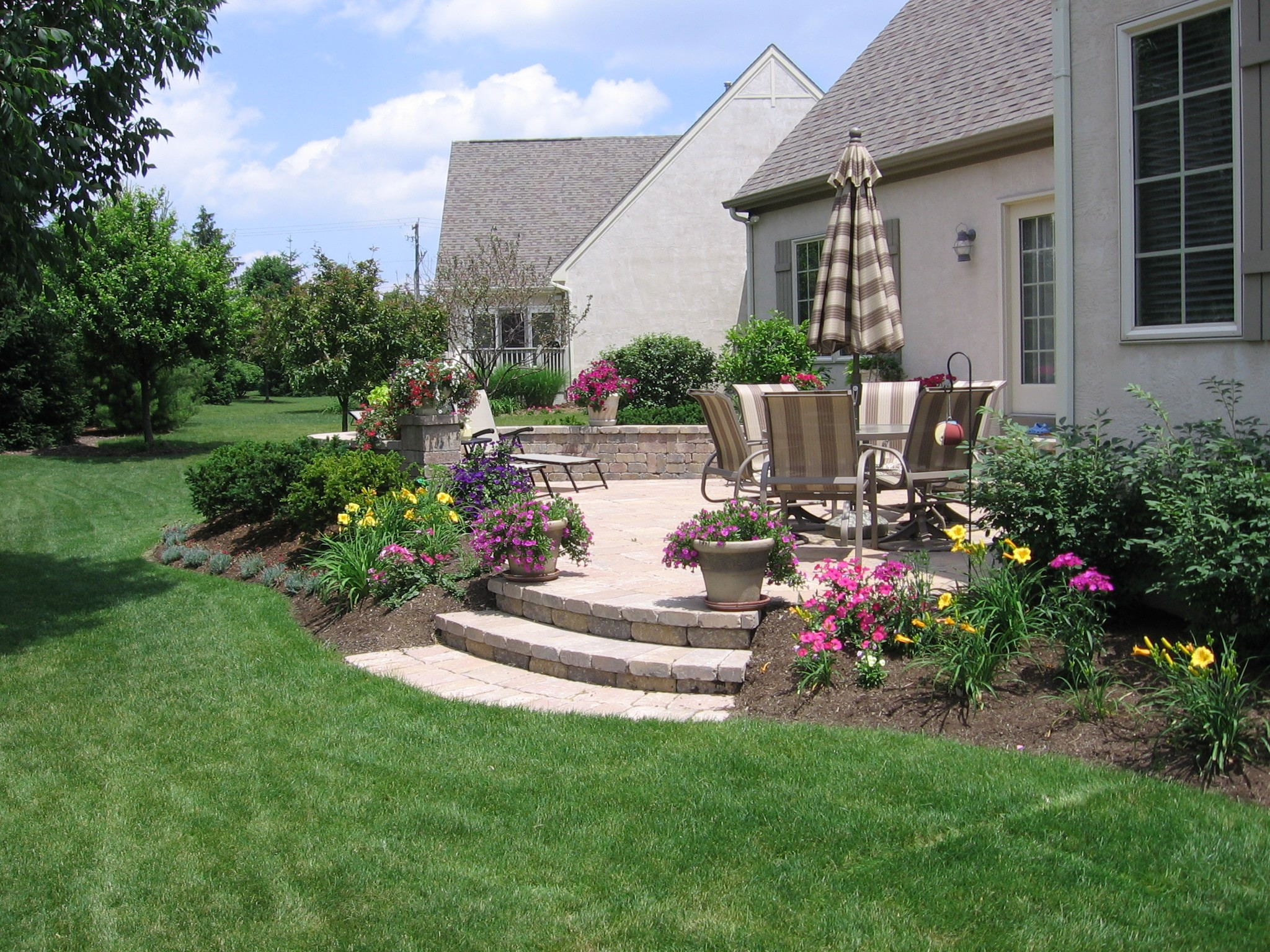Landscape Around Patio
 Pave Your Way to Better Living Buck and Sons Landscape