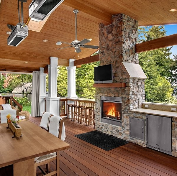 Outdoor Kitchen And Fireplace Ideas
 Stone fireplace next to the outdoor kitchen and a lovely