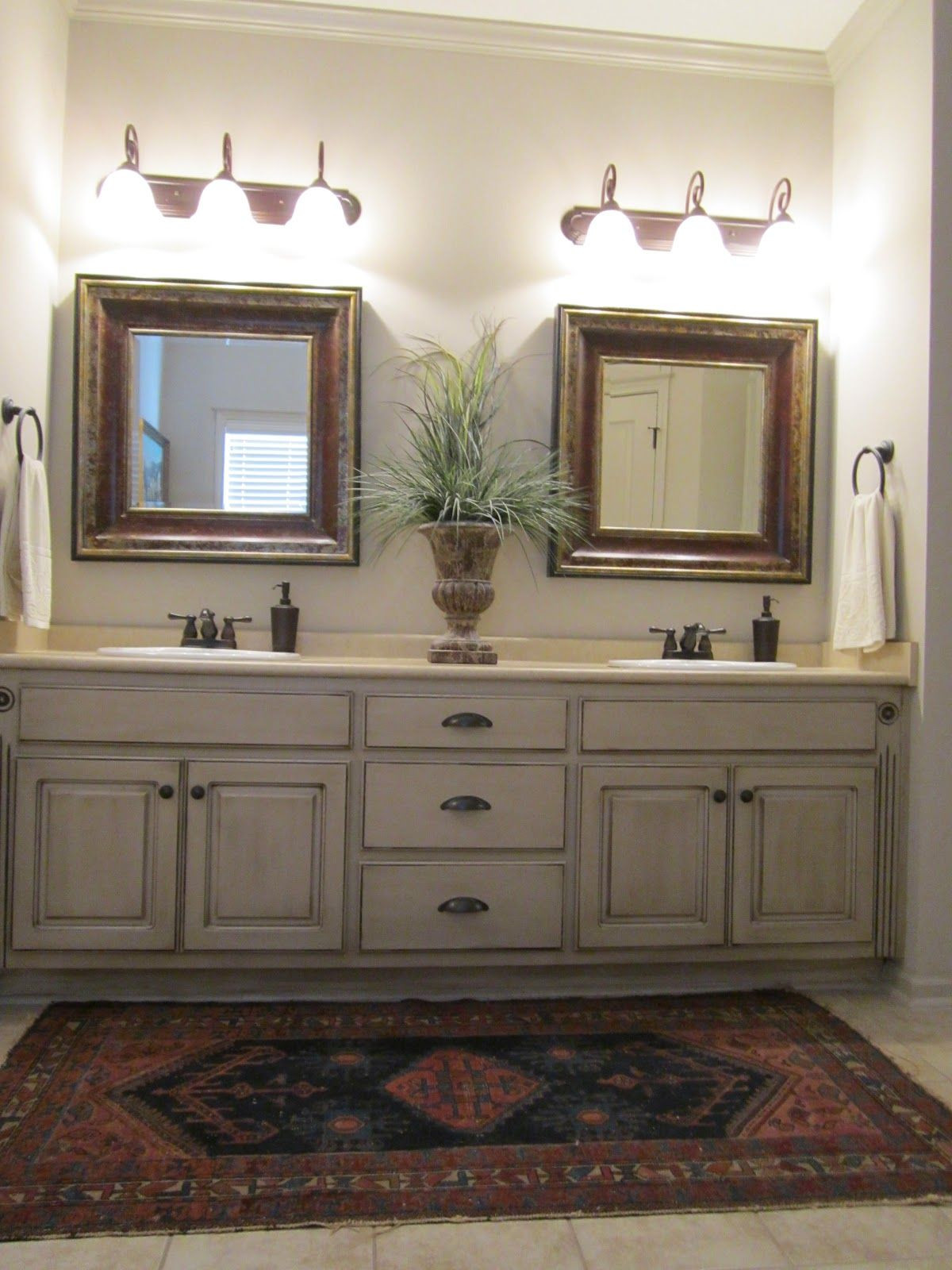 Painting Bathroom Cabinets Color Ideas
 Love these painted bathroom cabinets and the lights What