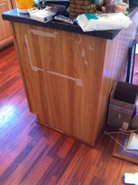 Repair Kitchen Cabinet
 How do I repair laminate damage on a kitchen cabinet