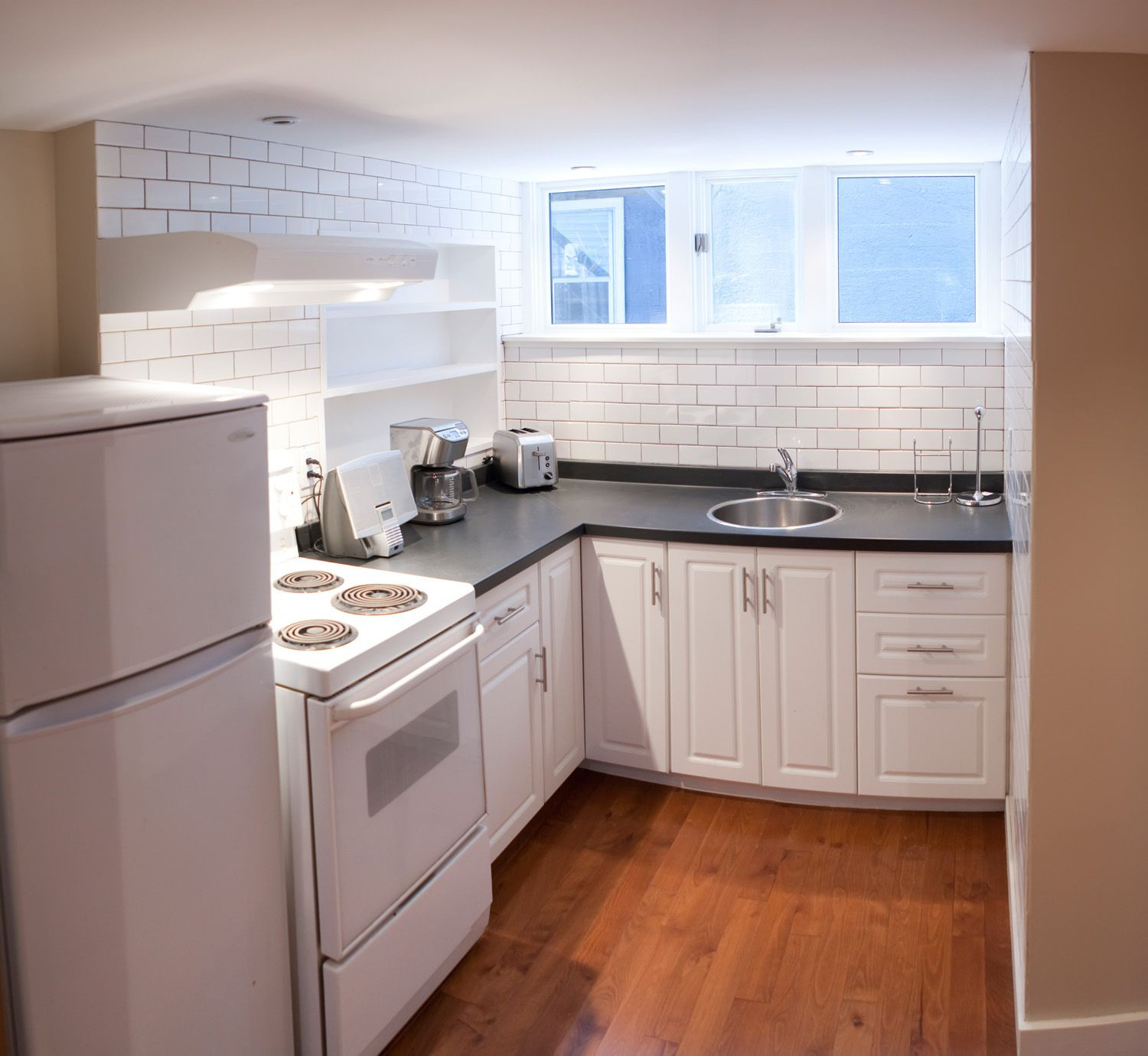 small kitchen in basement        
        <figure class=