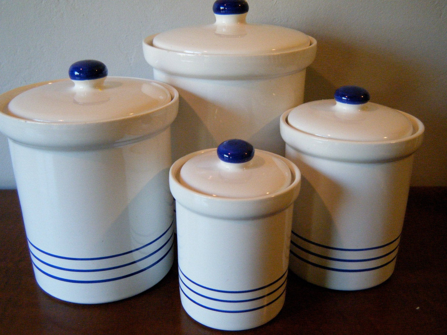 White Kitchen Canisters
 Set 4 White Eartenware Kitchen Canisters with Blue Stripes